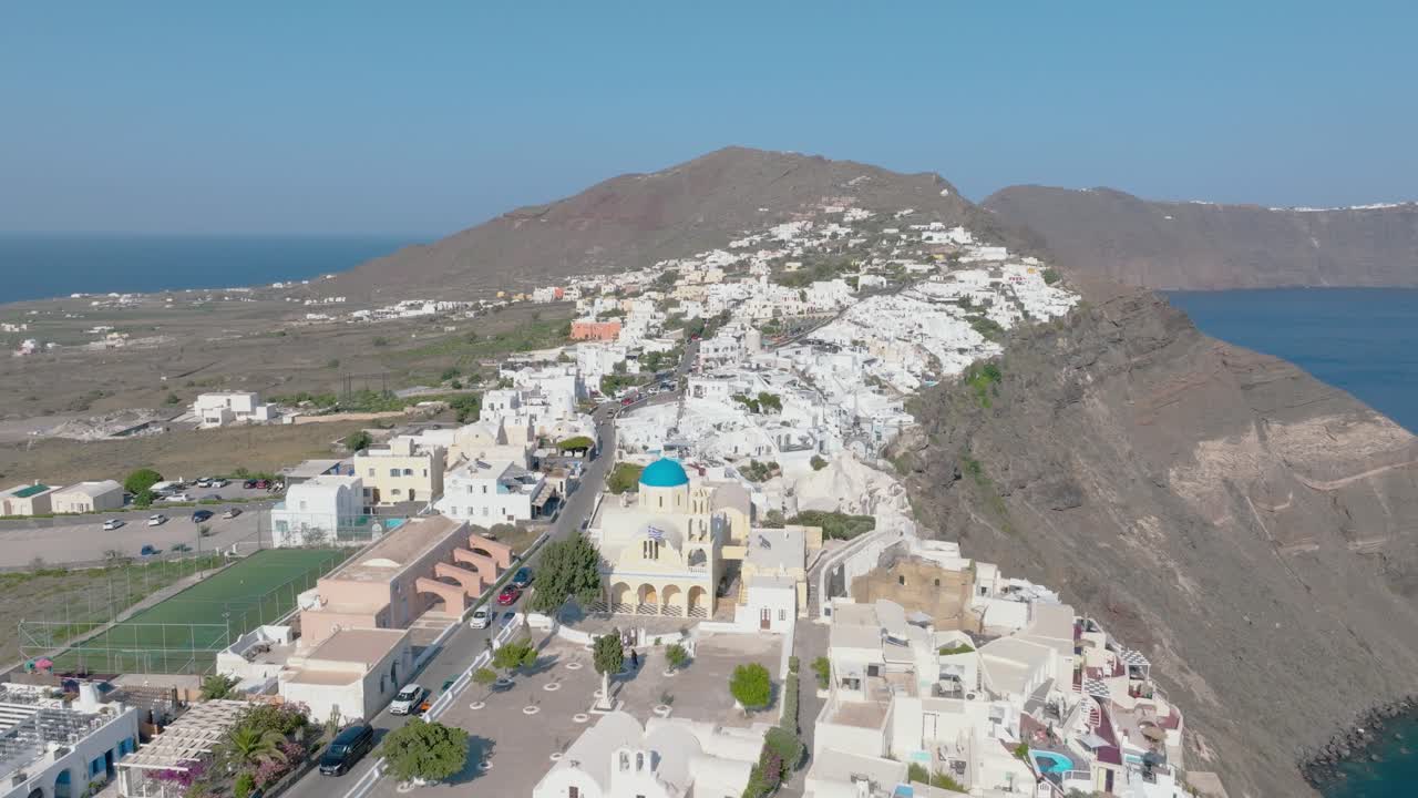 Overfly Santorini's lush vineyards and wineries, a verdant oasis within this Aegean paradise