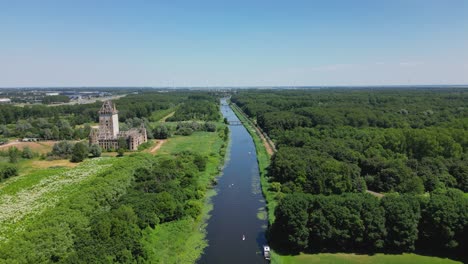 aerial drone shot above a nature park, water canal, abandoned kastel of almere city, province flevoland, netherlands