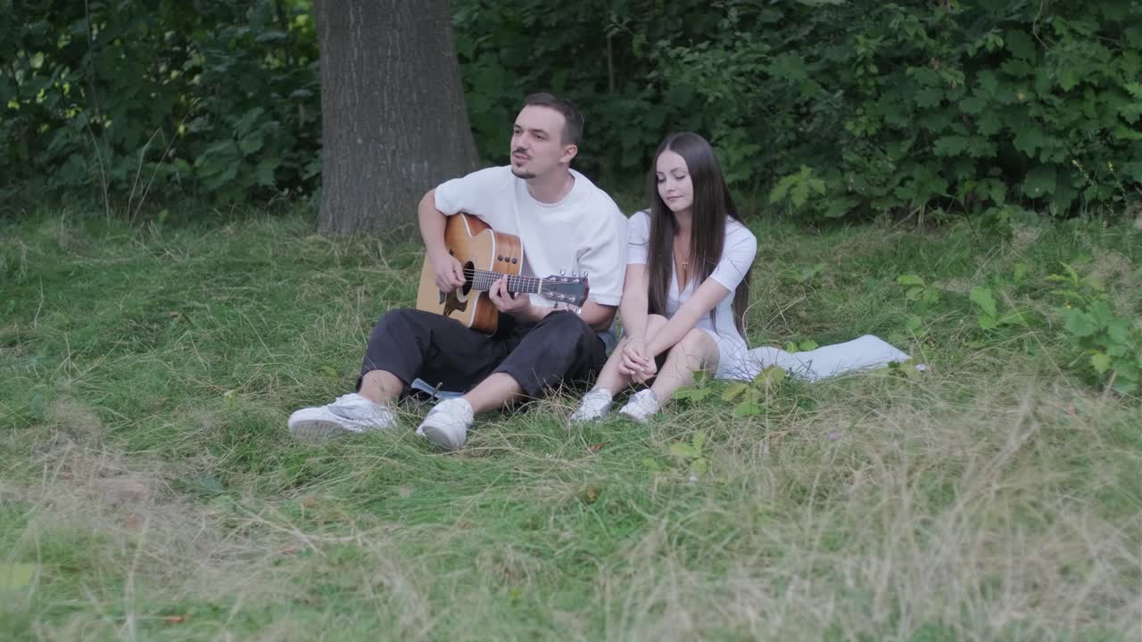 Couple enjoying music in the park