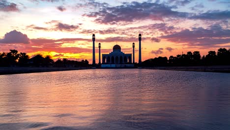 4k time lapse silhouette view of central mosque at sunset in songkhla, thailand