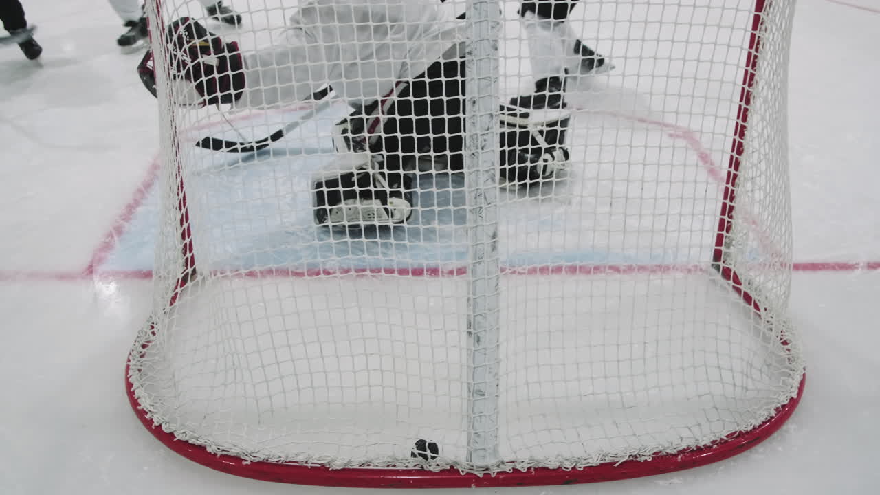 Shooting Hockey Puck Into Gate