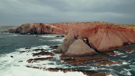 dramatic coastal cliffs and red rocks