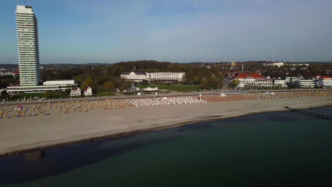 Flight towards an empty beach in the morning