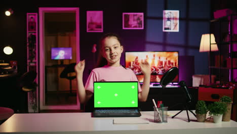 cute gen z influencer showing mockup notebook device to viewers