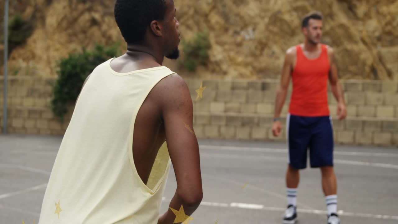 Teammate passing blue basketball, front player catching, cradling, scanning court, preparing shot