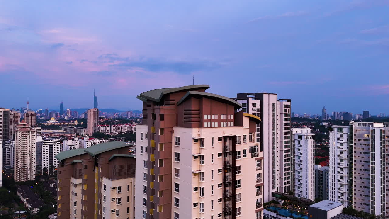 Aerial Skyline of KL Kuala Lumpur Malaysia at sunset , suburban building with Downton at distance