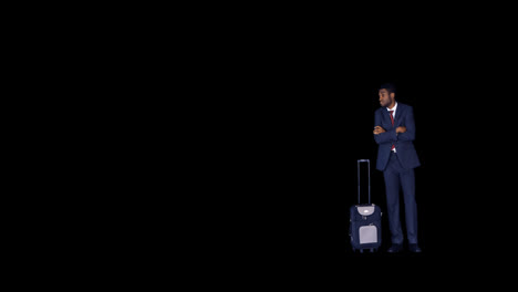 Businessman-standing-with-arms-crossed-with-his-luggage