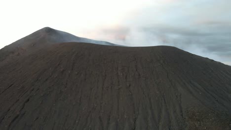 volcanic eruption: aerial view of a smoking volcano