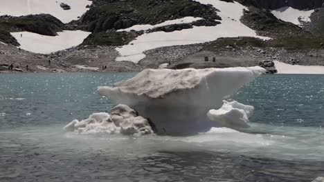 close up of a pack of floating ice in a beautiful blue lake in the austrian alps, uttendorf weissee