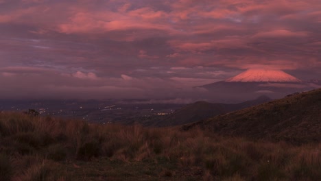 timelapse of cotopaxi volcano with dramatic sunset light and moving clouds
