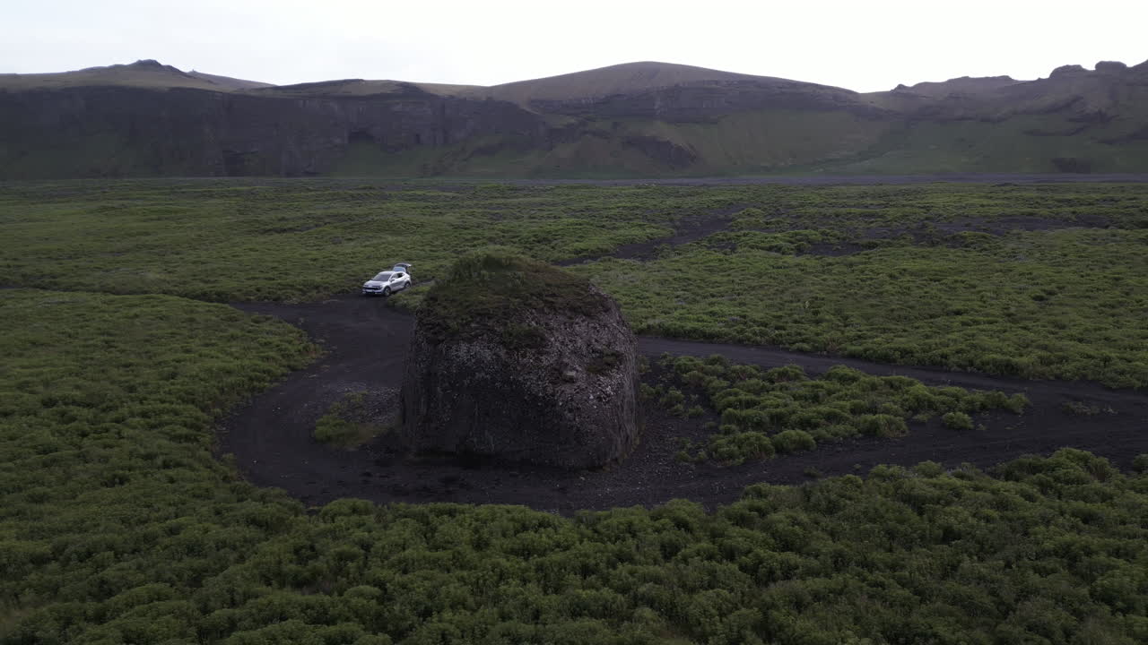 Kötluklettur Large Glacial Boulder In Hjörleifshöfði Trailhead In Southern Iceland. Aerial Rotate Shot