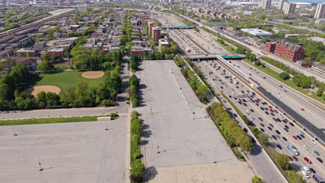 i-90 highway traffic in south chicago usa, drone shot of expressway and downtown in misty skyline