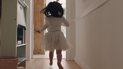 happy little girl running through house wearing tutu excited to play outside child having fun on weekend morning enjoying childhood 4k footage