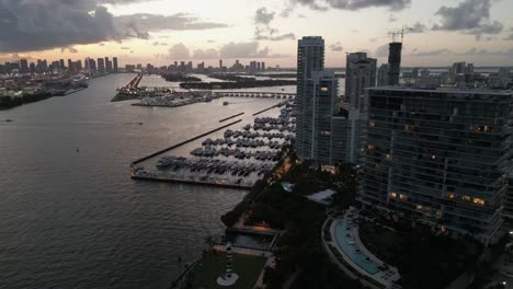 miami south beach skyline illuminated at sunset aerial drone