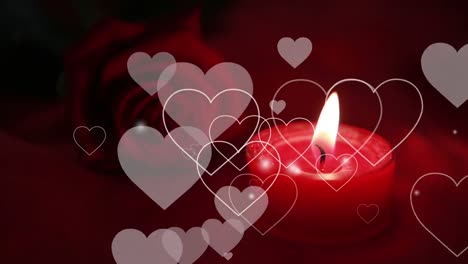 Animation-of-hearts-moving-over-candle-and-red-rose-in-background