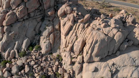 Aerial-view-of-huge-rock-formation-in-California-desert,-extreme-travel-destination-in-USA