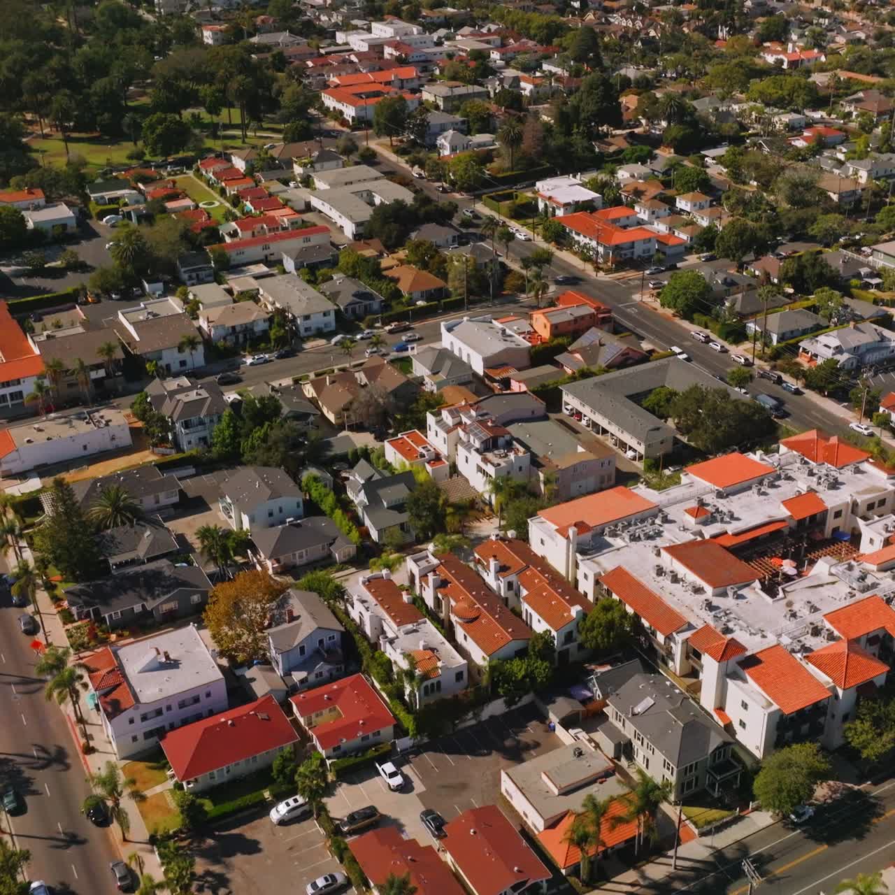 Lovely sight of Santa Barbara houses with similar orange roofs. Beautiful streets of sunny city from aerial perspective
