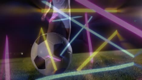 Animation-of-neon-shapes-over-caucasian-football-player-kicking-ball-at-stadium