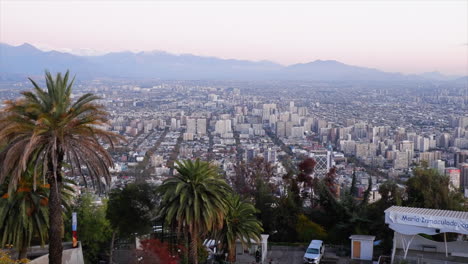 Pan-across-Santiago-Chile-city-skyline-from-atop-San-Cristobal-Hill