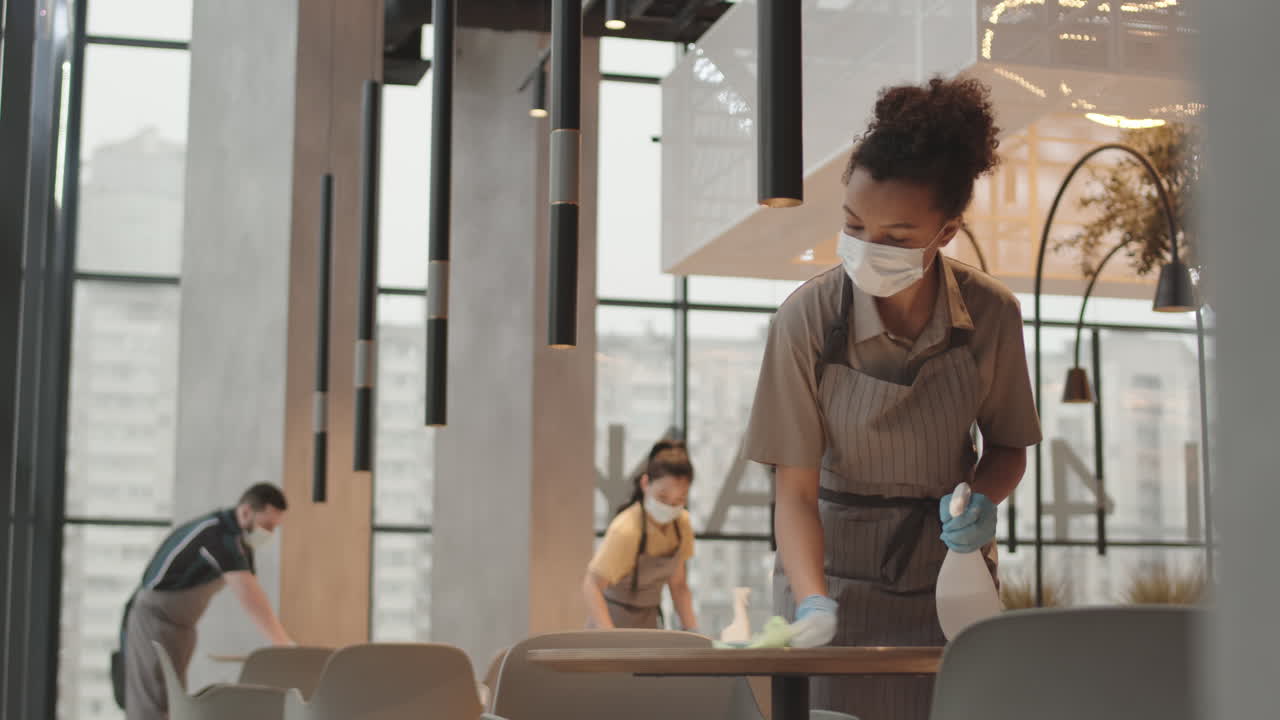 Employees Cleaning in Restaurant Before Opening