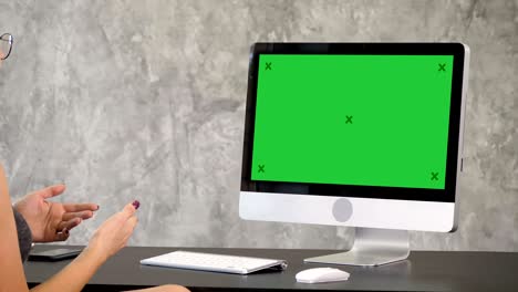 woman having video call. green screen mock-up display