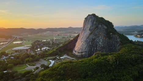 4k fast wide pan around buddha mountain in pattaya at stunning sunrise