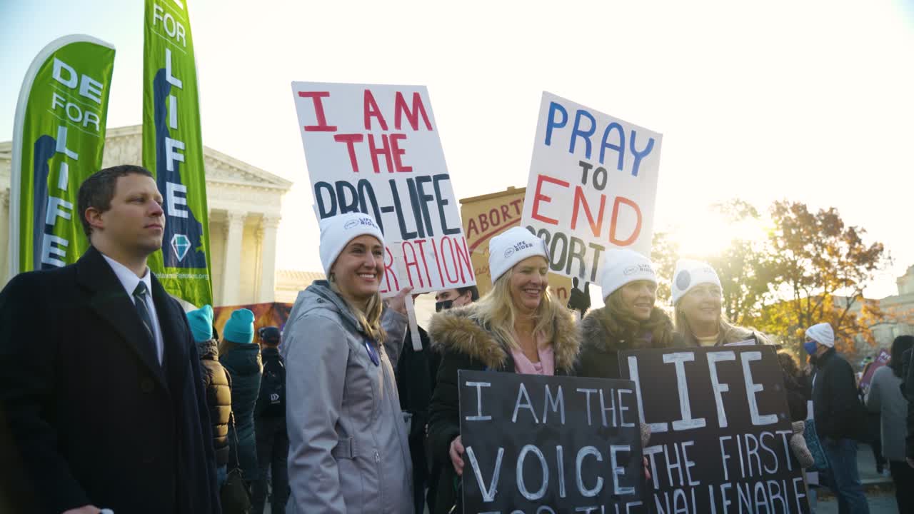 Girls posing with their protest signs.