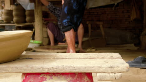 Potters-finish-and-transport-unfired-clay-bowl-in-Than-Ha-village-Vietnam-Hoi-An