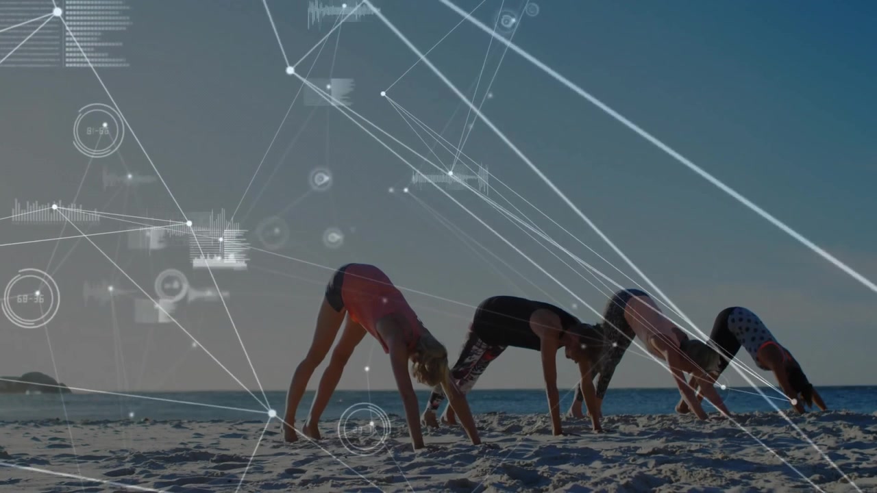 Group of Women Practicing Yoga on Beach with Digital Data Overlay