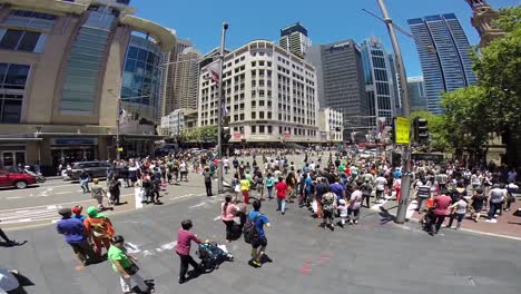 crowd in sydney crossing the streets during boxing day.