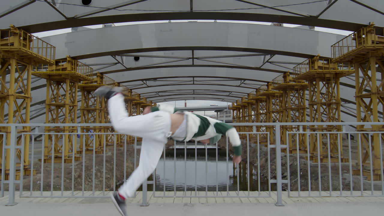Parkour Athlete Doing Side Flip at Urban Construction Site