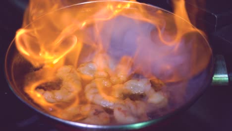 cooking flambe shrimps in pan