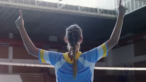 Female-volleyball-player-standing-with-arms-up-4k