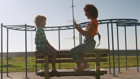 mother and son having fun at playground