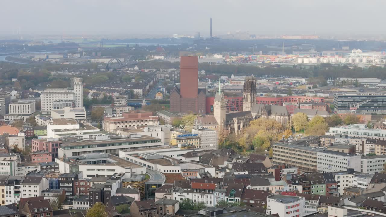 Aerial view of Duisburg city centre with Rhine river in background, daytime partly cloudy weather