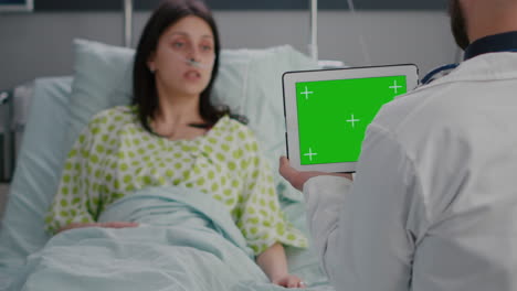 physician practitioner man discussing with woman patient resting in bed