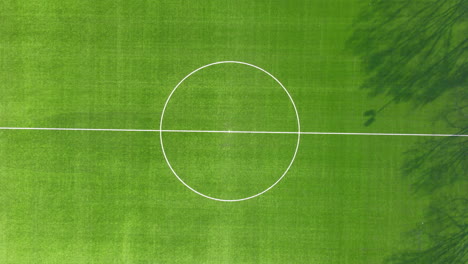 high top down view of center spot on soccer field - slowly zooming out