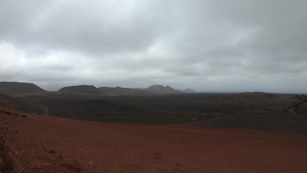 Volcanic Landscape Within Timanfaya National Park Under Cloudy Sky During Daytime In Lanzarote, Spain. timelapse
