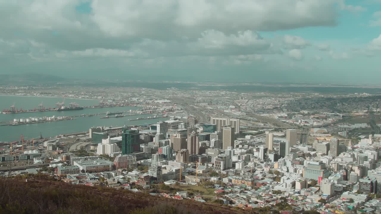 Slow panning shot of Cape Town city bowl with cloudy sky