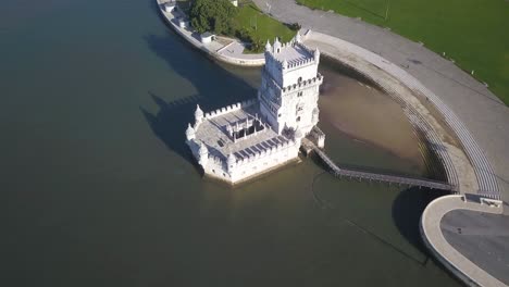 aerial view of torre de belem or belem tower in lisbon, portugal and the bridge ponte 25 de abril