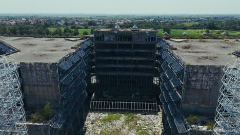 abandoned hospital in zagreb with crumbling facade and exposed steel structures under clear sky