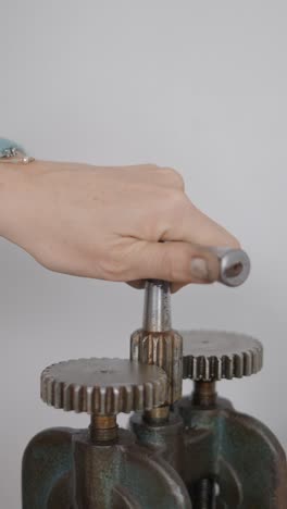 close-up of a hand operating a gear mechanism