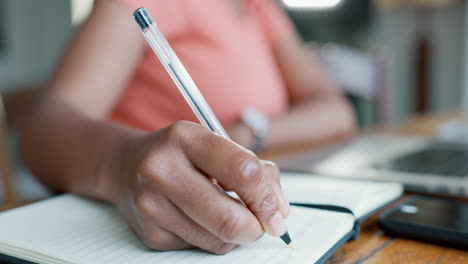 Notebook,-hands-and-writing-information-for-study