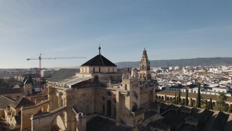 aerial pan revealing the top parts of mosque-cathedral of cordoba, spain