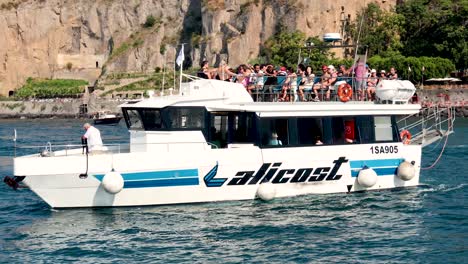 a boat with tourists near sorrento pier