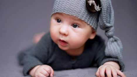 baby in grey outfit