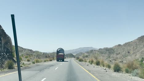 pov driving along rcd highway overtaking another lorry in balochistan