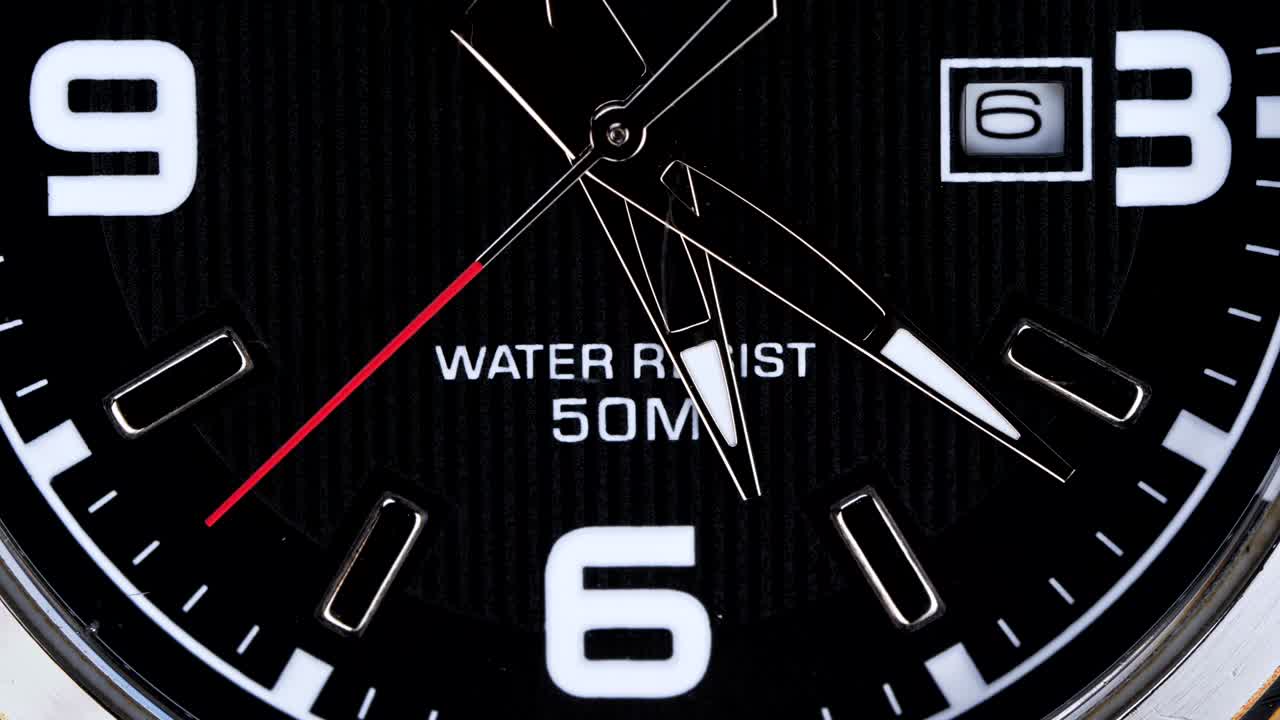 The movement of the hands of a wristwatch.