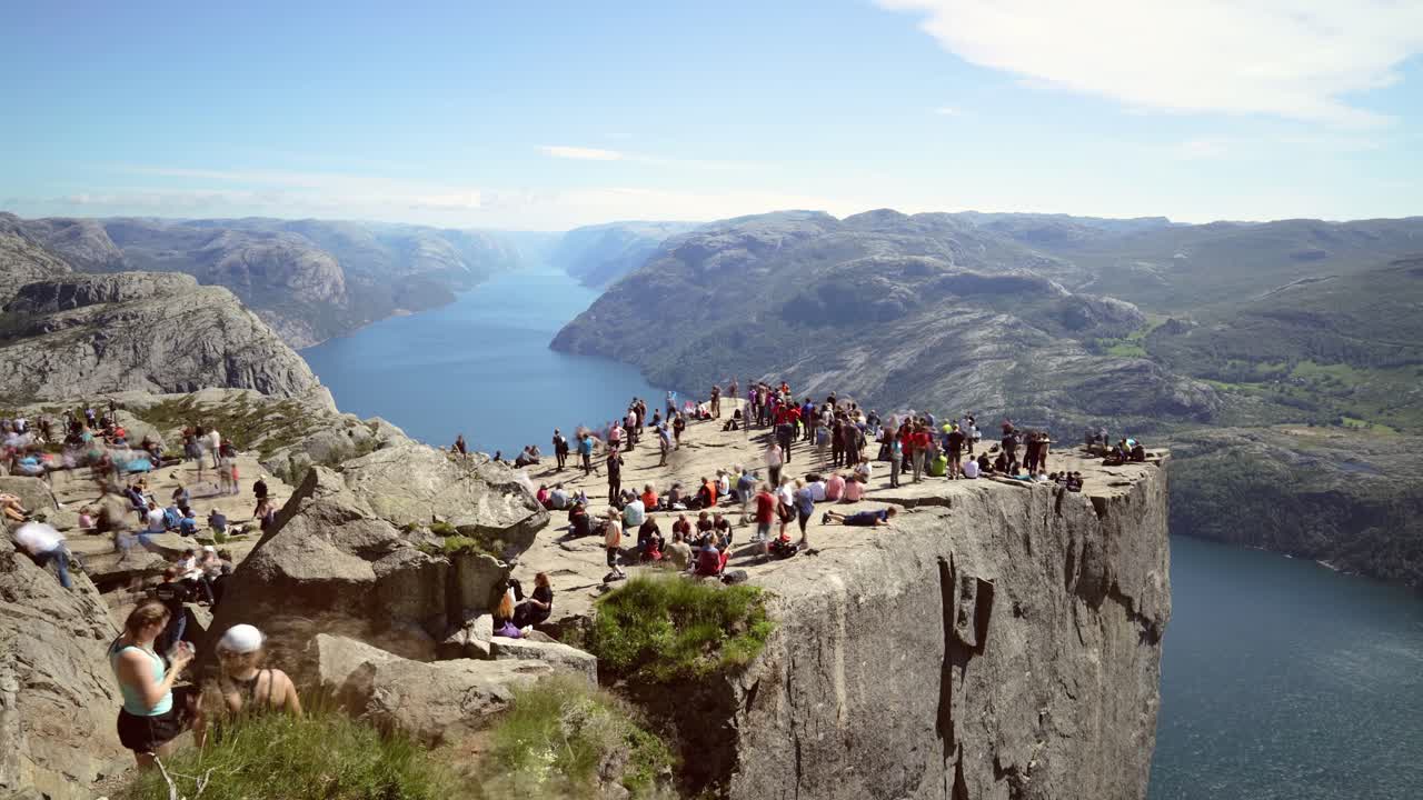NORWAY- June 15, 2019: Preikestolen or Prekestolen, also known by the English translations of Preacher's Pulpit or Pulpit Rock, is a famous tourist attraction in Forsand, Ryfylke, Norway