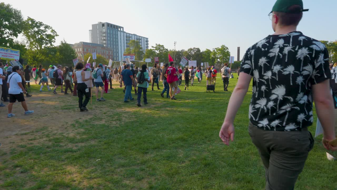 a diverse group of activists, united during the DNC in a peaceful street demonstration. Free Palestine flag symbolizing the global call for peace and justice.